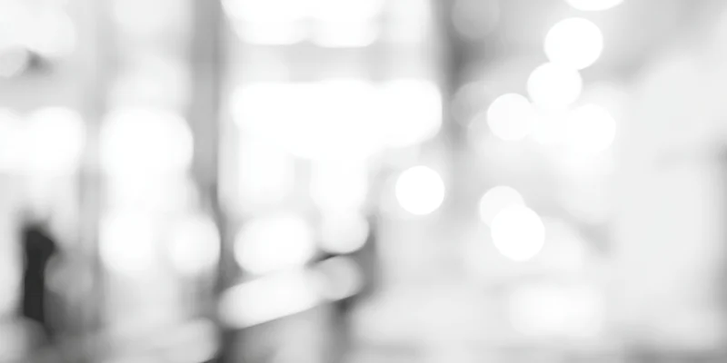 Blurred lights in a high-key grayscale interior space