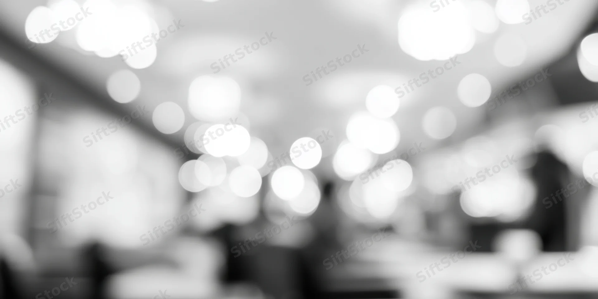 Blurred interior with soft glowing lights on ceiling