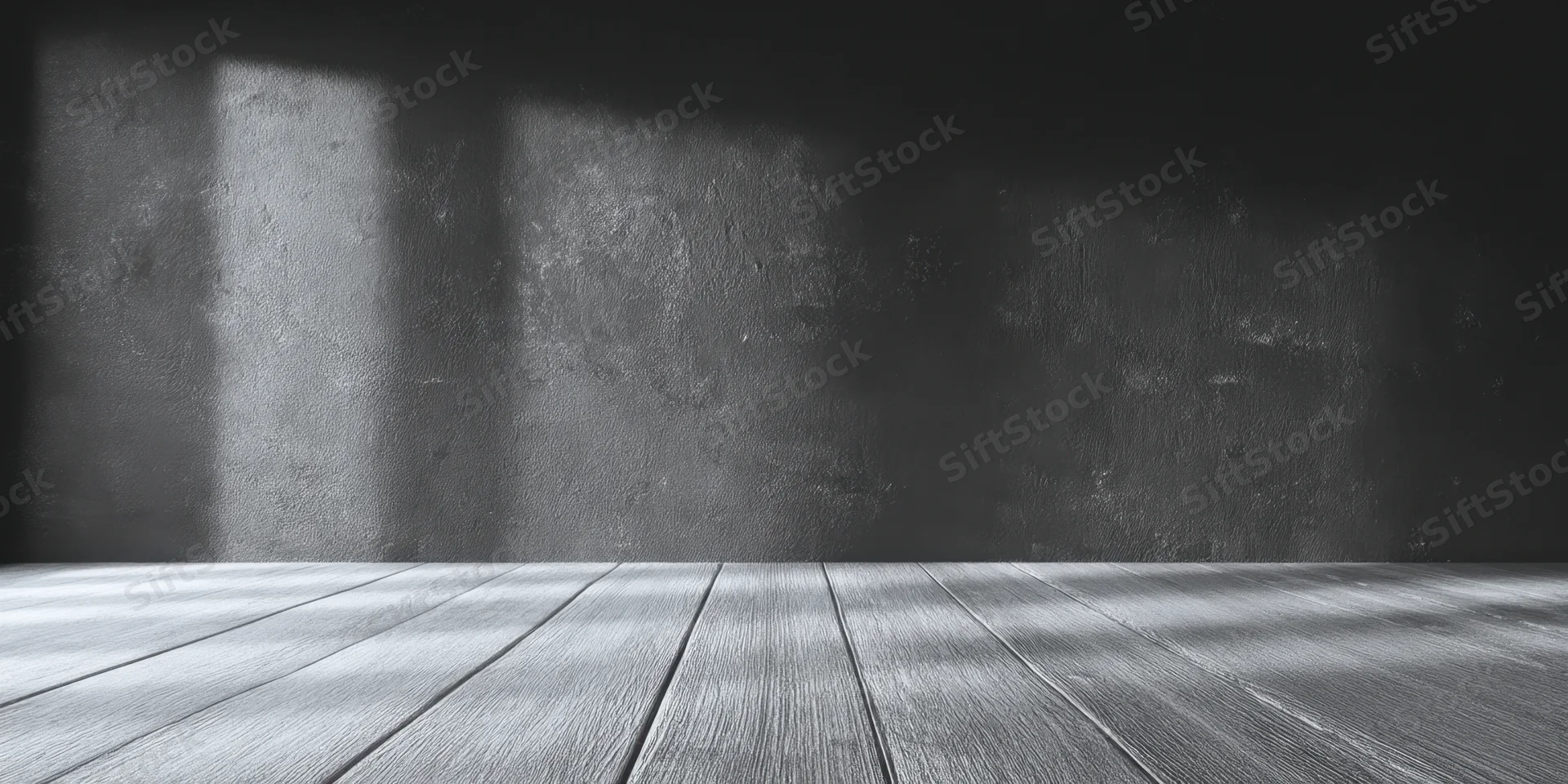 Dark textured wall with wooden floor in moody grayscale interior