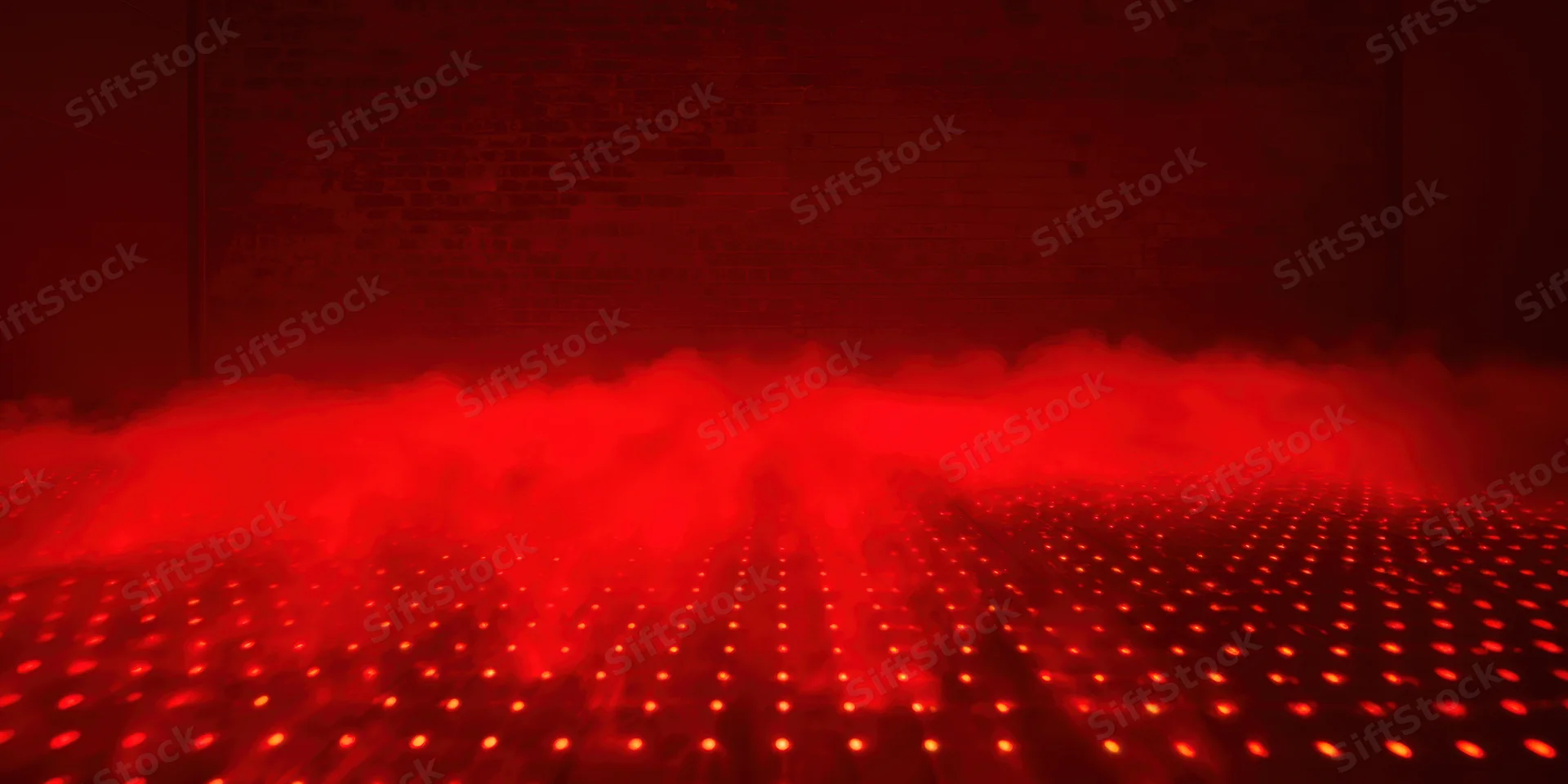 Red fog rolling over a grid of glowing dots on a dark floor in a dimly lit room