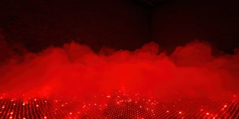 Red fog rolling over a grid of glowing lights on a brick-walled floor