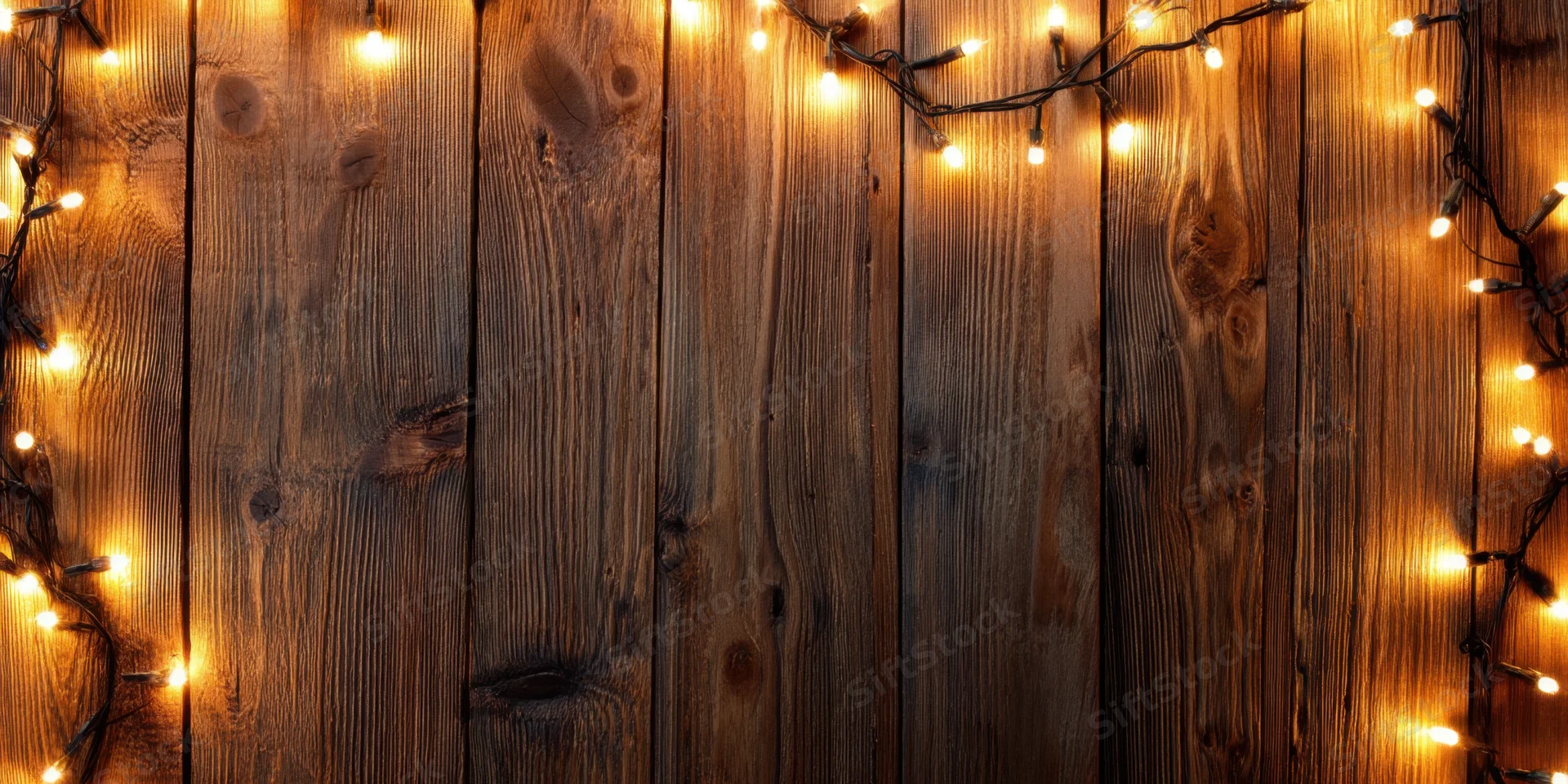 Warm string lights framing a rustic wooden wall with vertical planks and natural grain