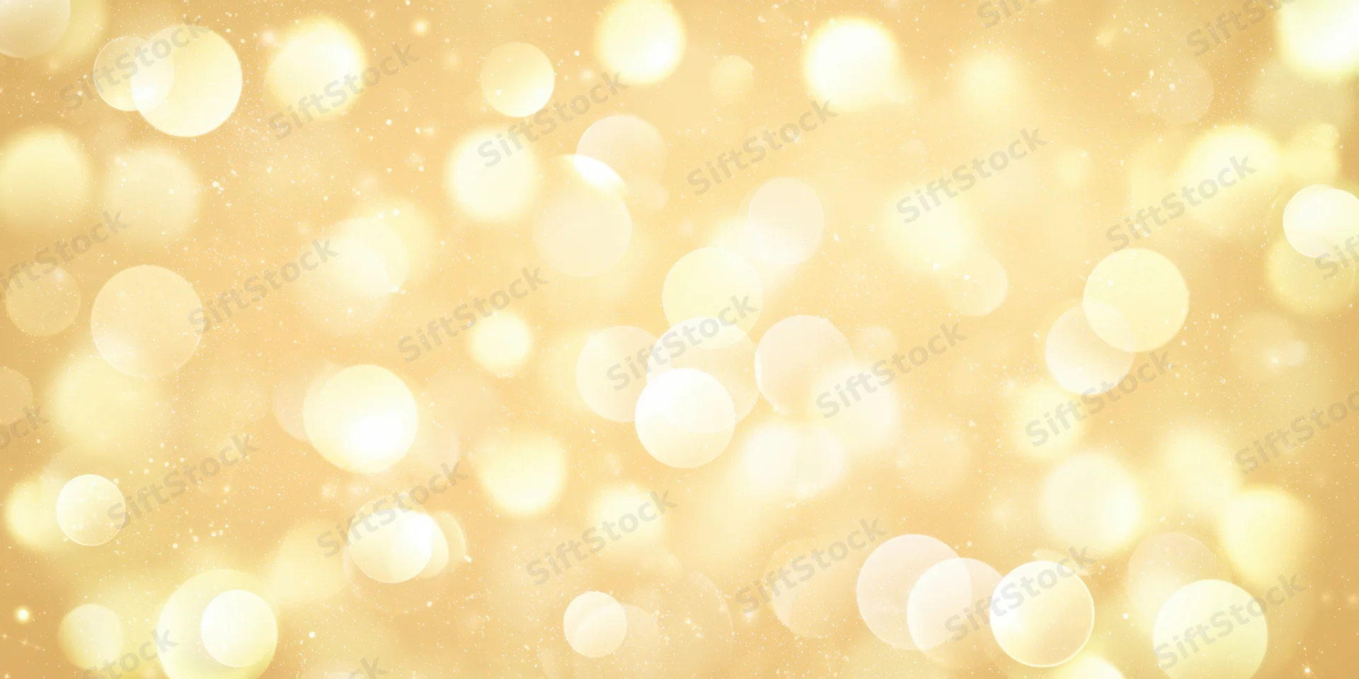 Golden bokeh lights scattered across a soft glowing background