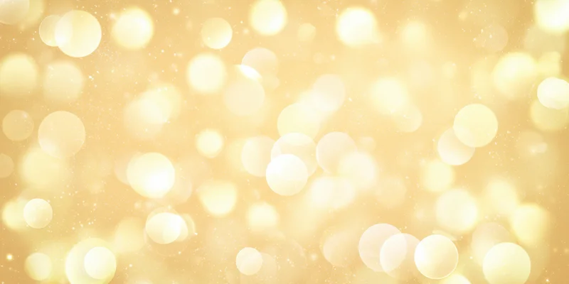 Golden bokeh lights scattered across a soft glowing background