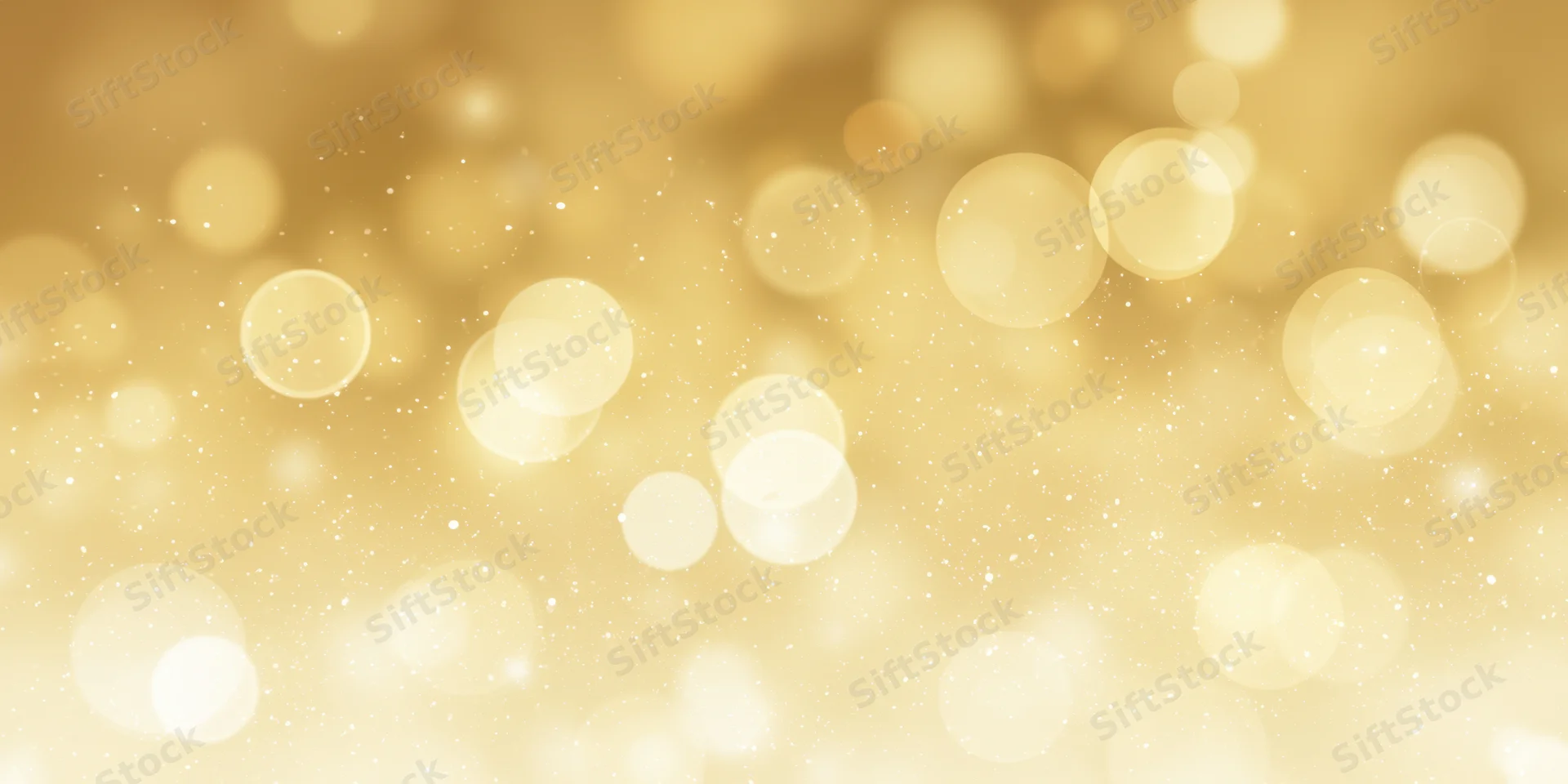 Soft golden background with round bokeh lights and scattered sparkles