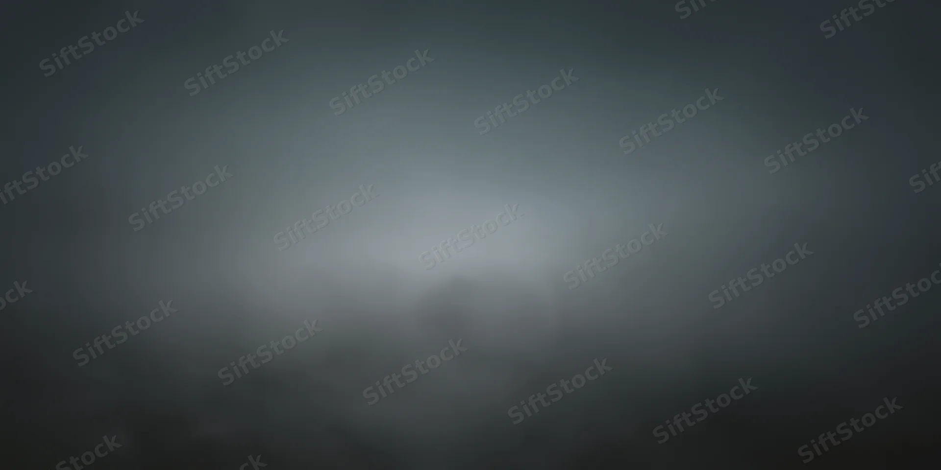 Soft gray fog filling the frame with diffuse lighting and no visible subject