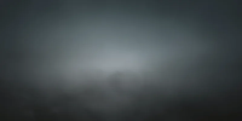 Soft gray fog filling the frame with diffuse lighting and no visible subject