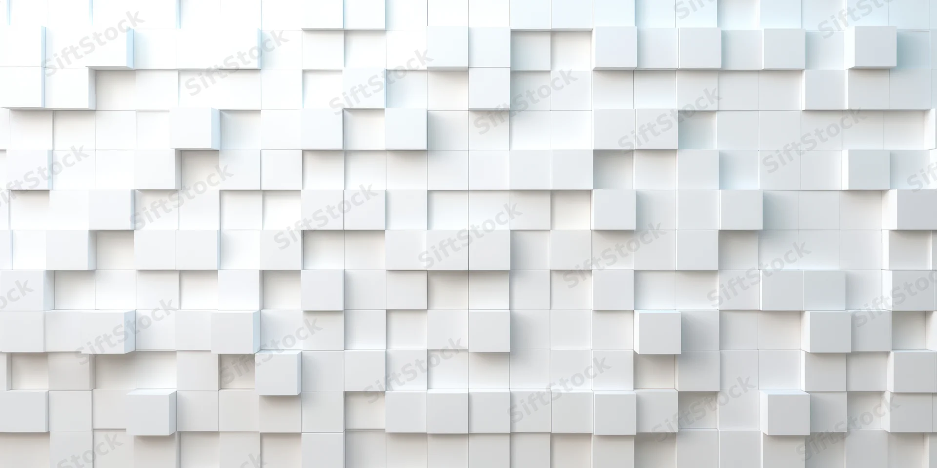 White geometric cubes arranged in a 3d pattern on a wall surface