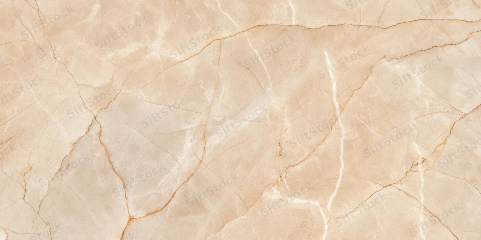 Close-up of a beige marble surface with natural veining and smooth texture