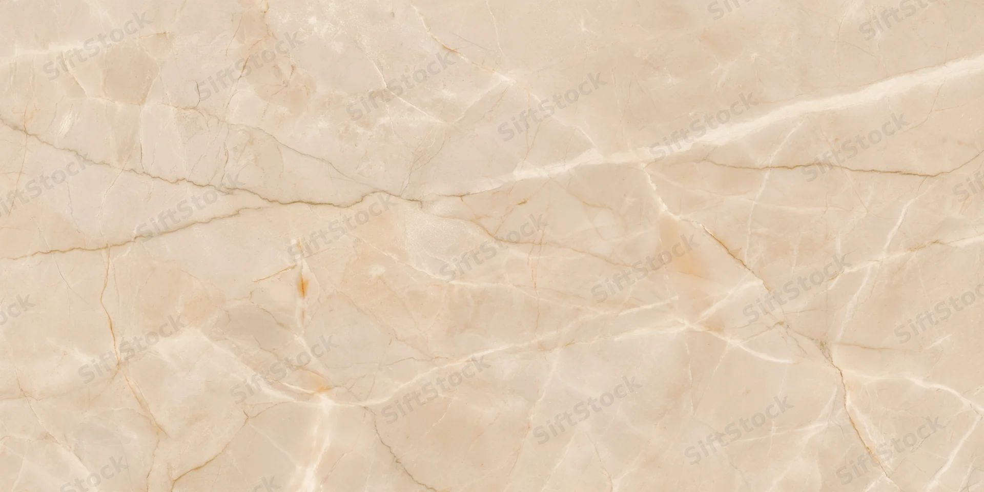 Close-up of a beige marble surface with delicate golden veining