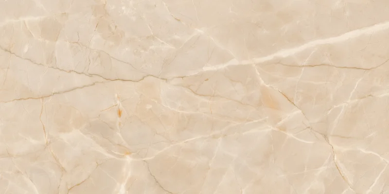 Close-up of a beige marble surface with delicate golden veining