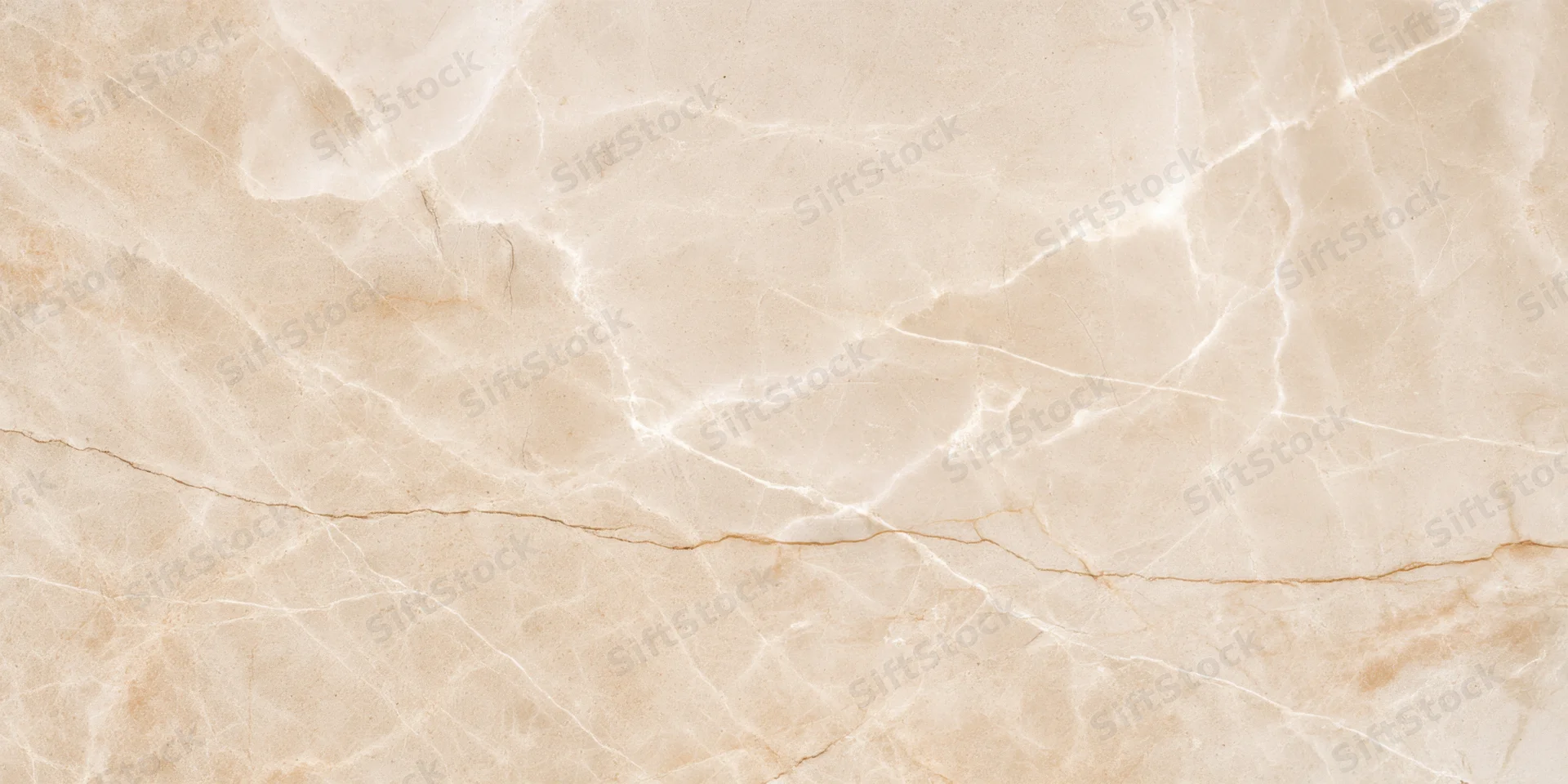 Close-up of a beige marble surface with delicate natural veining