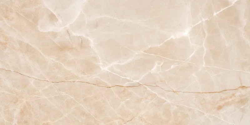 Close-up of a beige marble surface with delicate natural veining