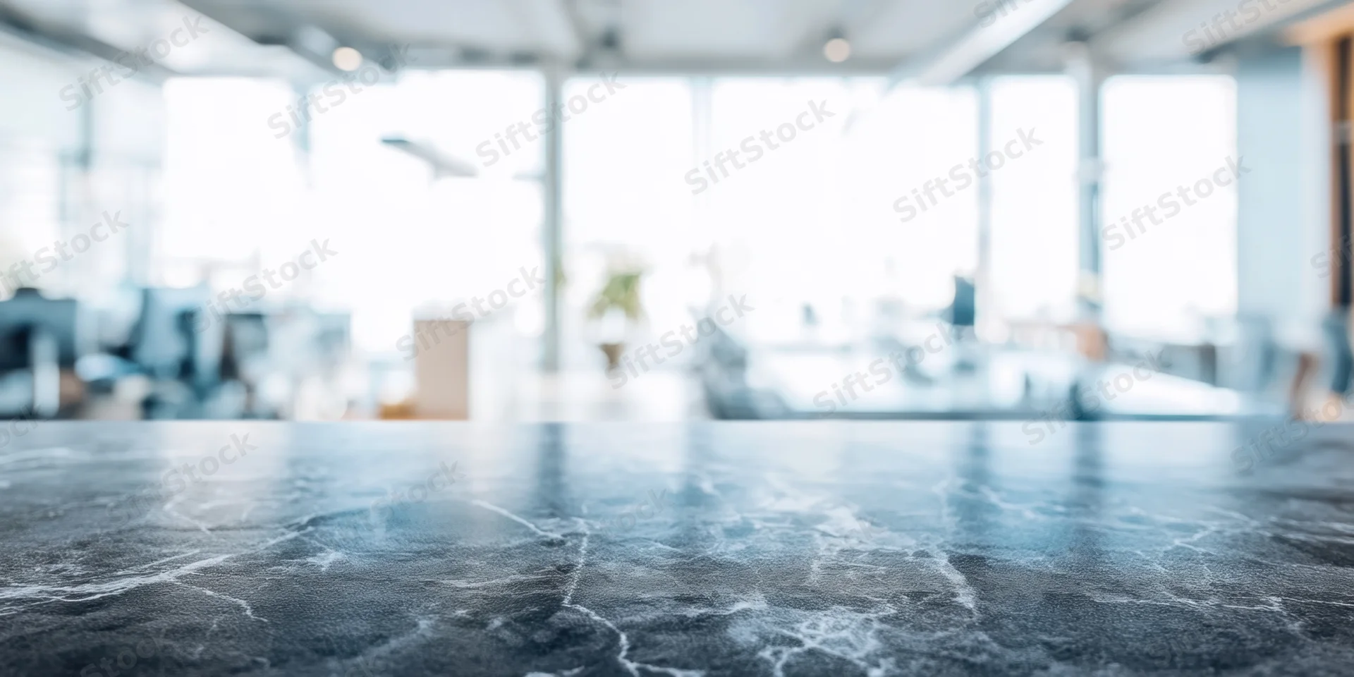 Dark veined marble countertop in modern office interior with blurred background and copyspace