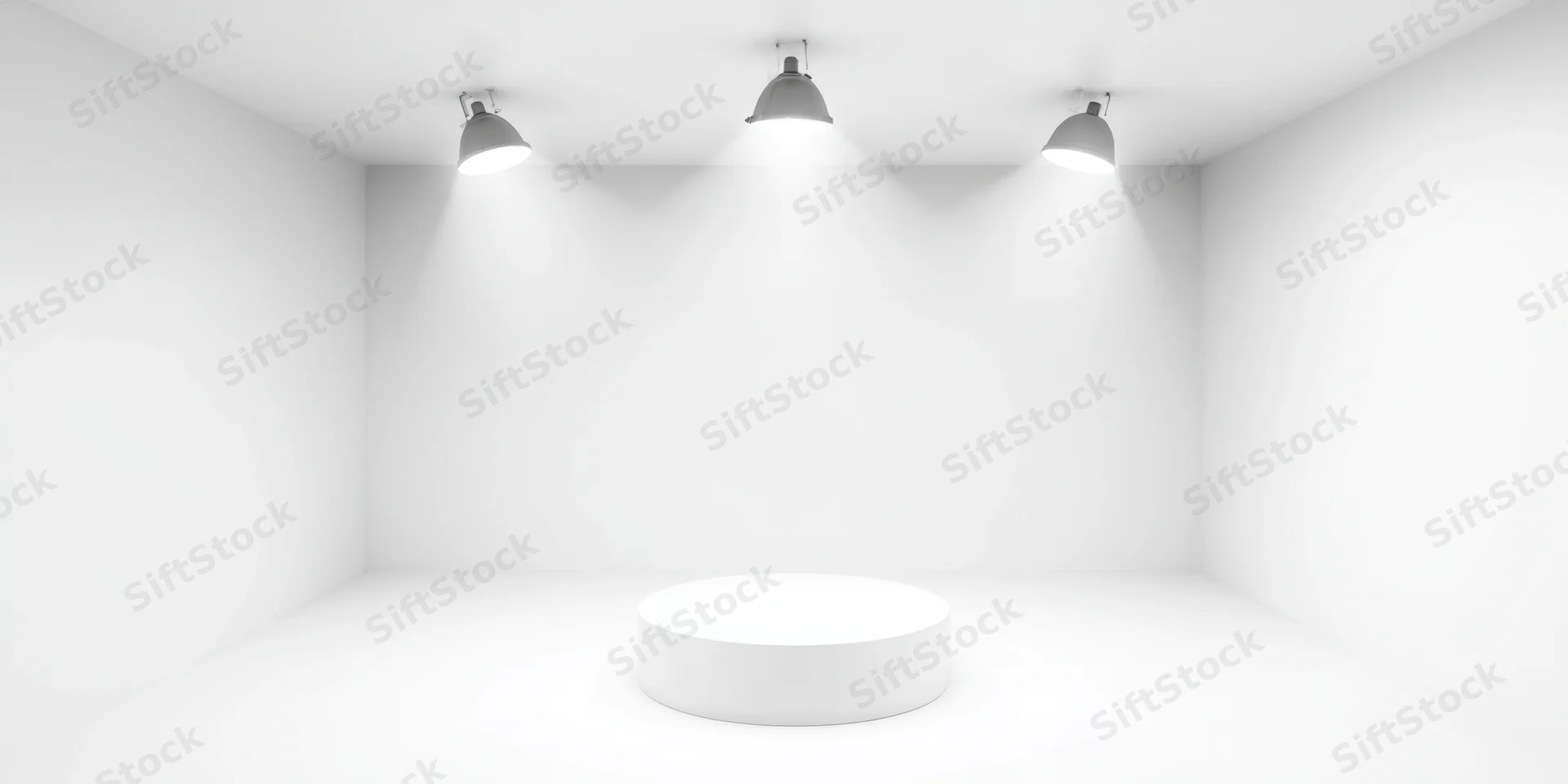 White circular pedestal under three overhead spotlights in a minimalist studio space