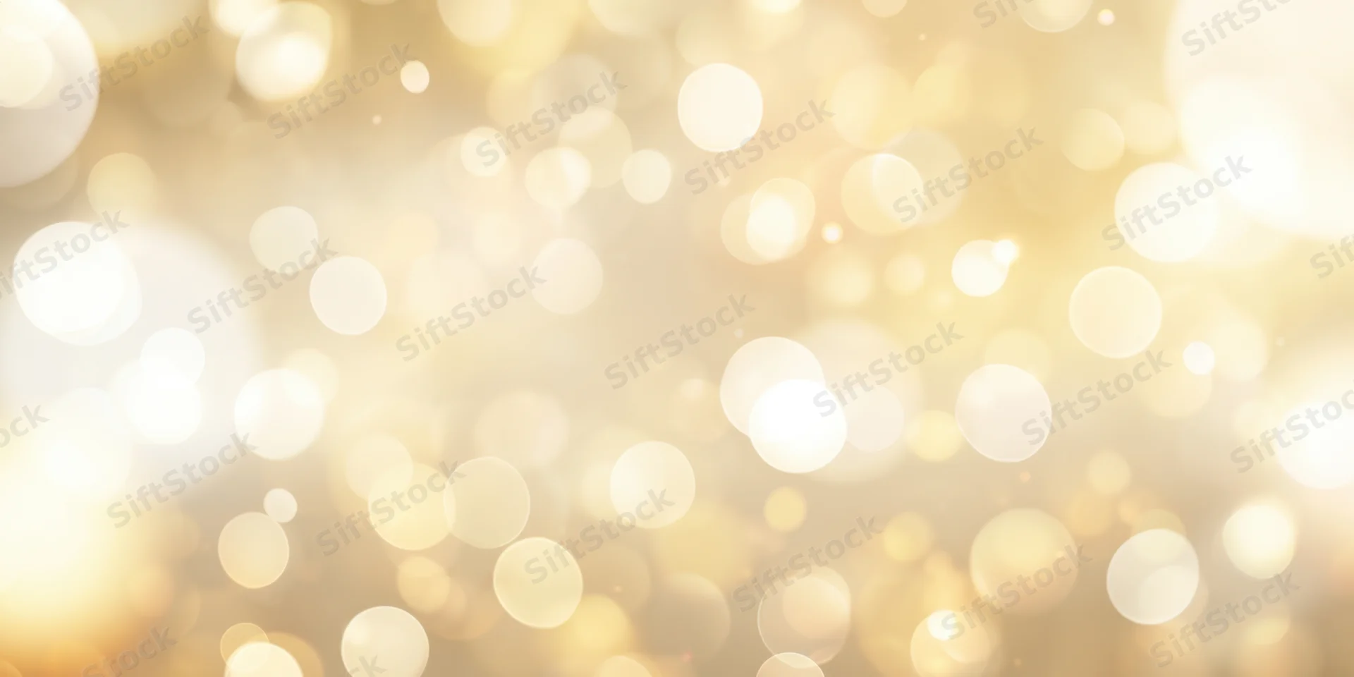 Soft golden bokeh background with scattered light orbs and warm glow