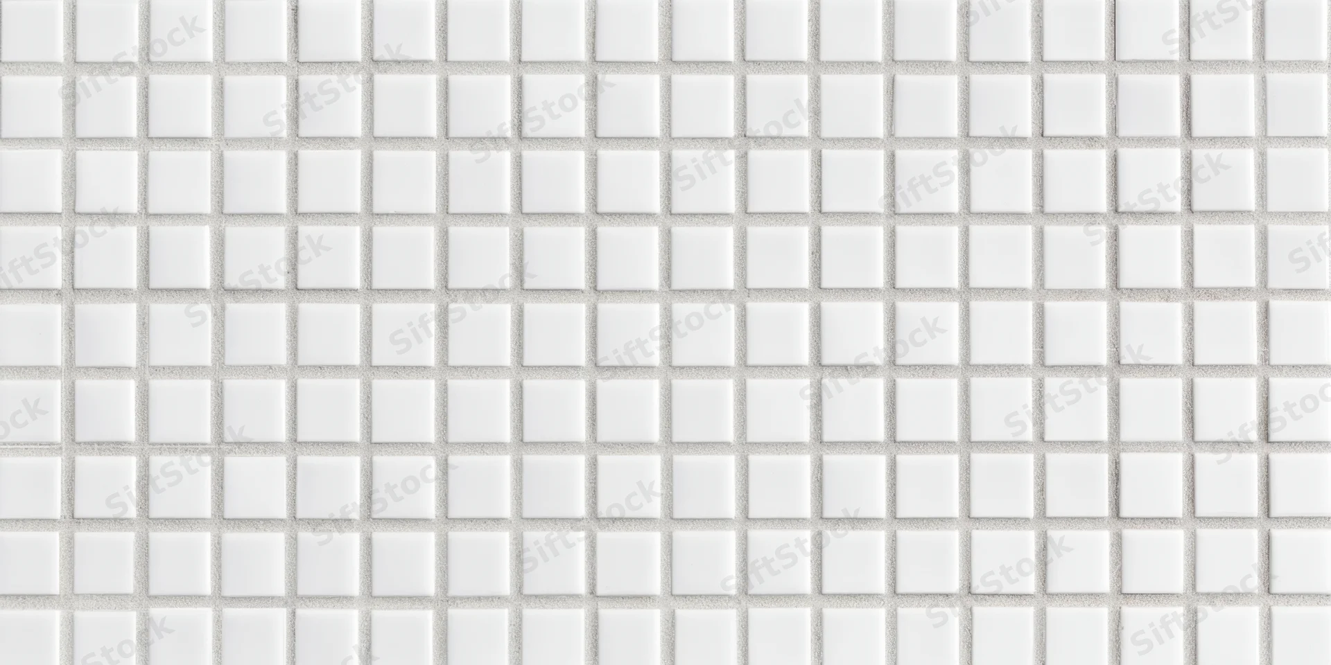 Seamless white square tile mosaic arranged in a grid pattern on a wall surface