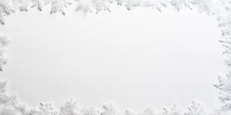 Delicate white snowflakes arranged in a border framing a blank white center