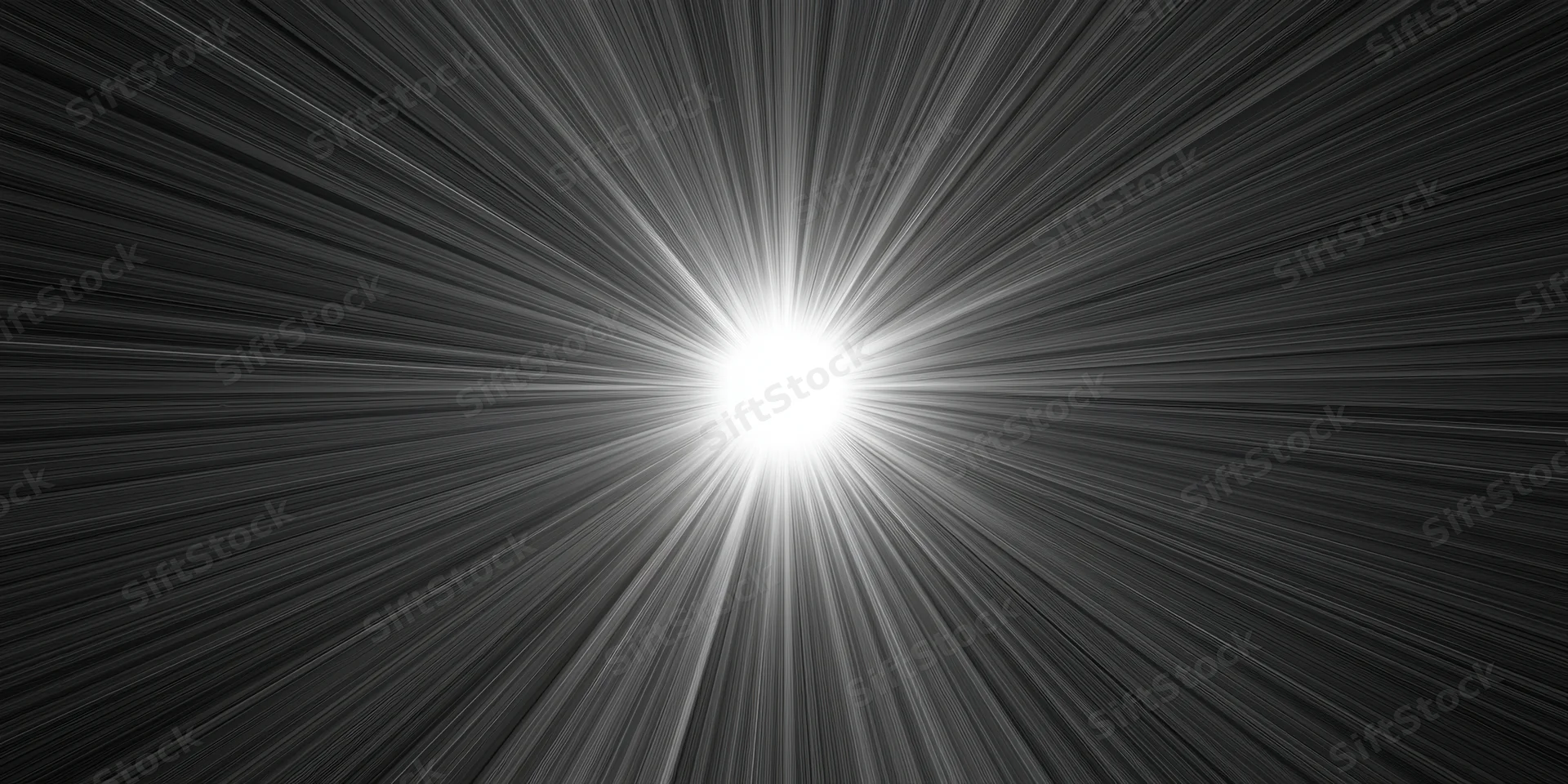 Bright white light flare with radiating rays across dark background