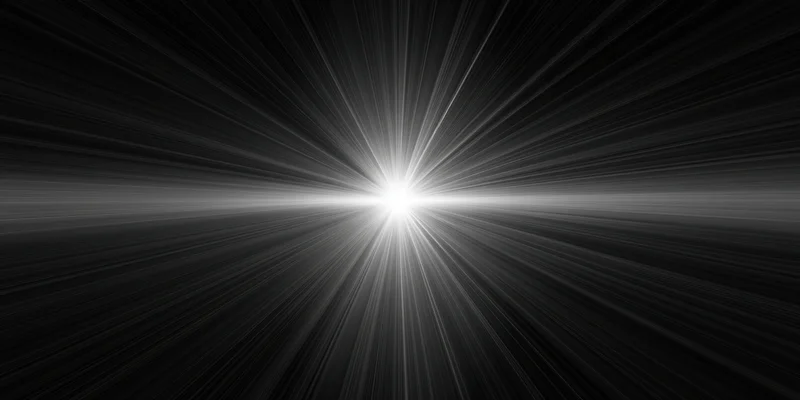 Bright light flare with radiating rays centered on black background