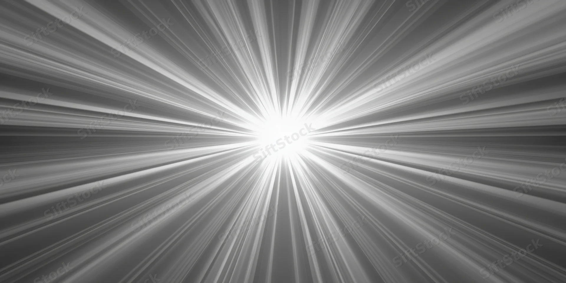 Bright light flare with radiating rays in monochrome abstract background