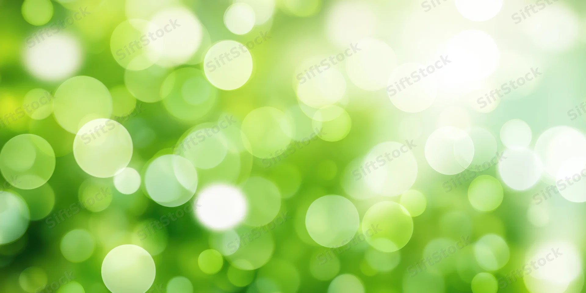 Bright green bokeh background with soft focus and sunlit glow