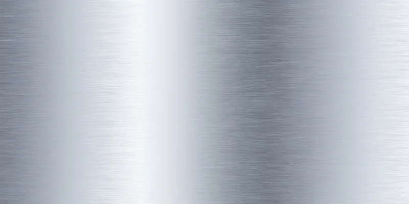 Brushed metal surface with subtle grain and soft reflectivity, showing a smooth metallic texture with even lighting and slight sheen