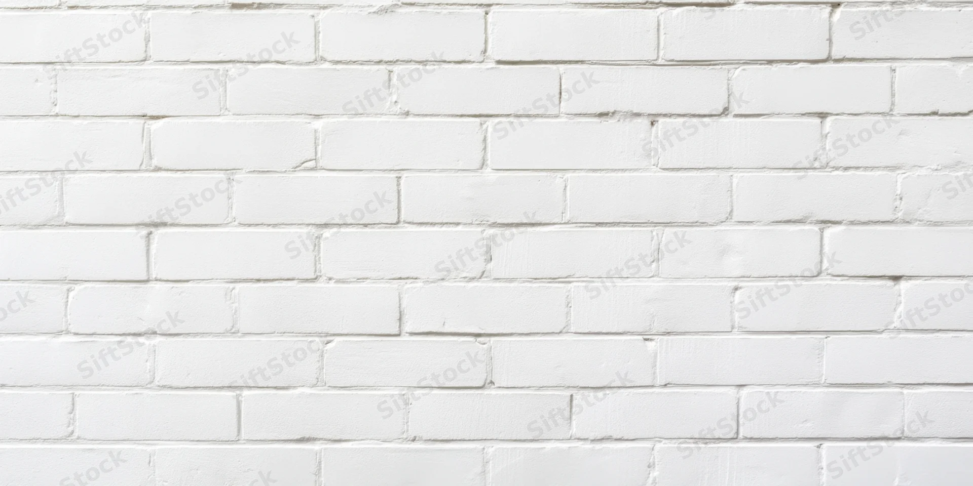 White brick wall with uniform bricks and subtle mortar lines, interior surface