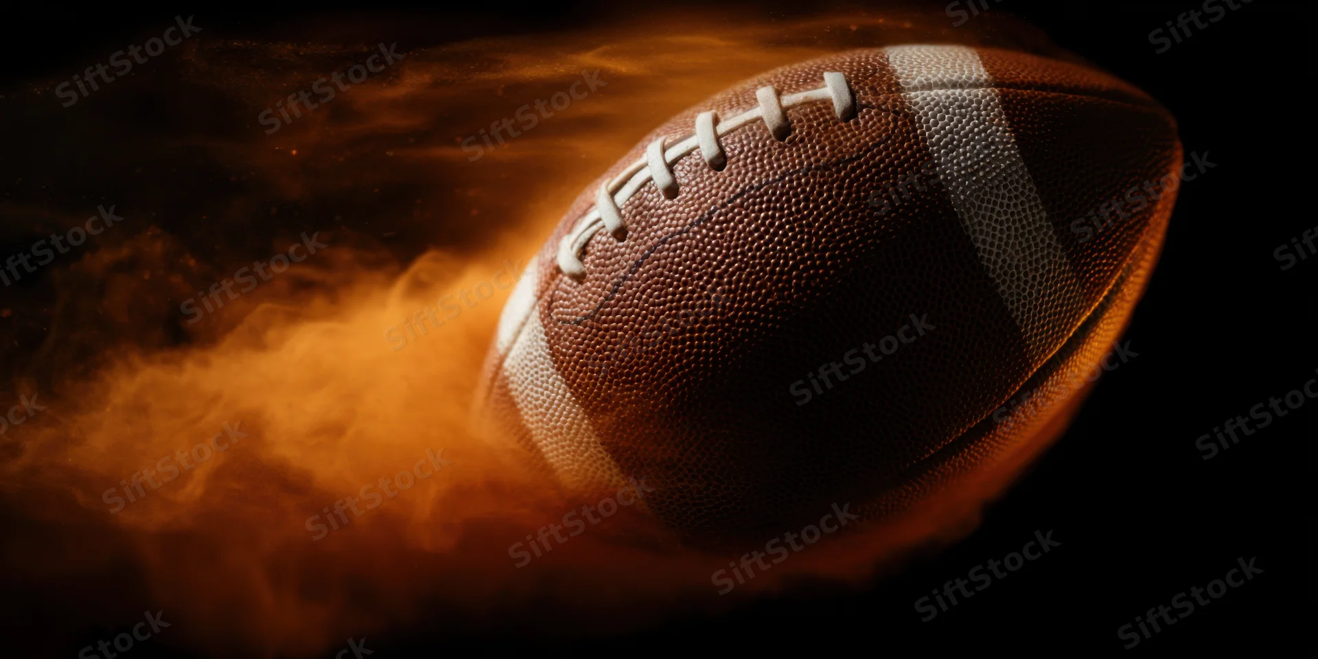 American football in motion with fiery smoke trail against dark background