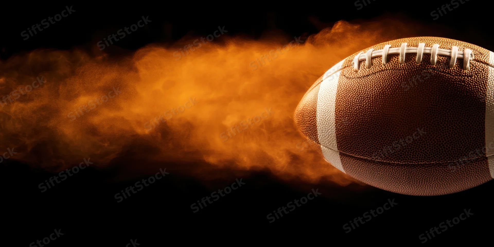 American football in motion with fiery orange smoke trail against black background