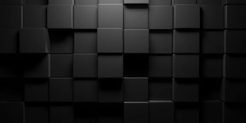 Matte black 3d cubes arranged in a grid pattern forming a textured wall surface