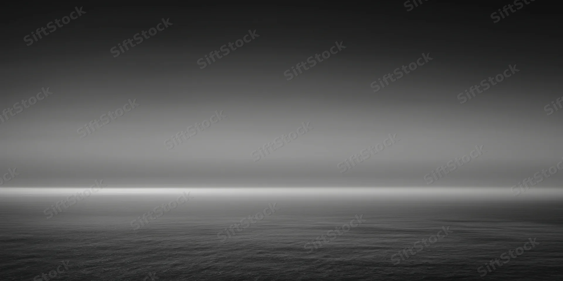 Calm expansive ocean under a gradient sky at twilight