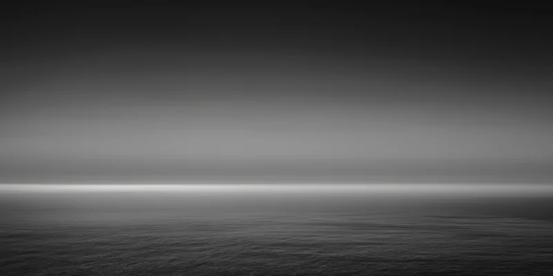 Calm expansive ocean under a gradient sky at twilight