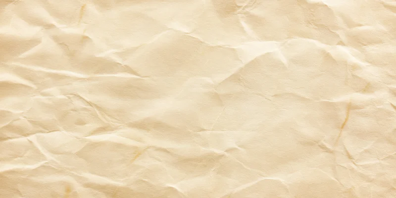 Crumpled beige parchment texture with subtle creases and folds filling the frame