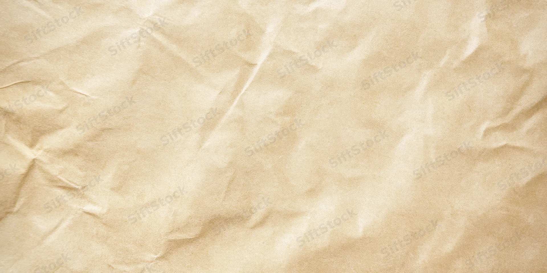 Pale beige parchment with subtle wrinkles and creases filling the frame