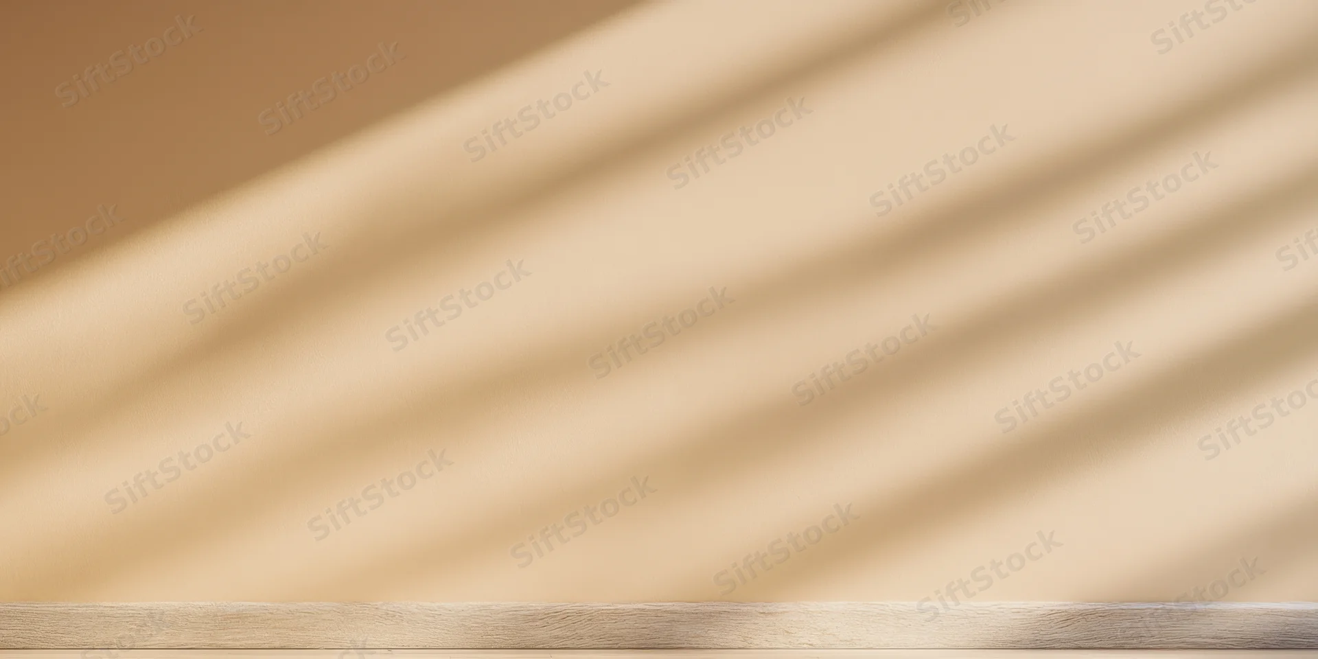 Warm beige wall with soft diagonal shadows from daylight, featuring a wooden plank surface at the bottom