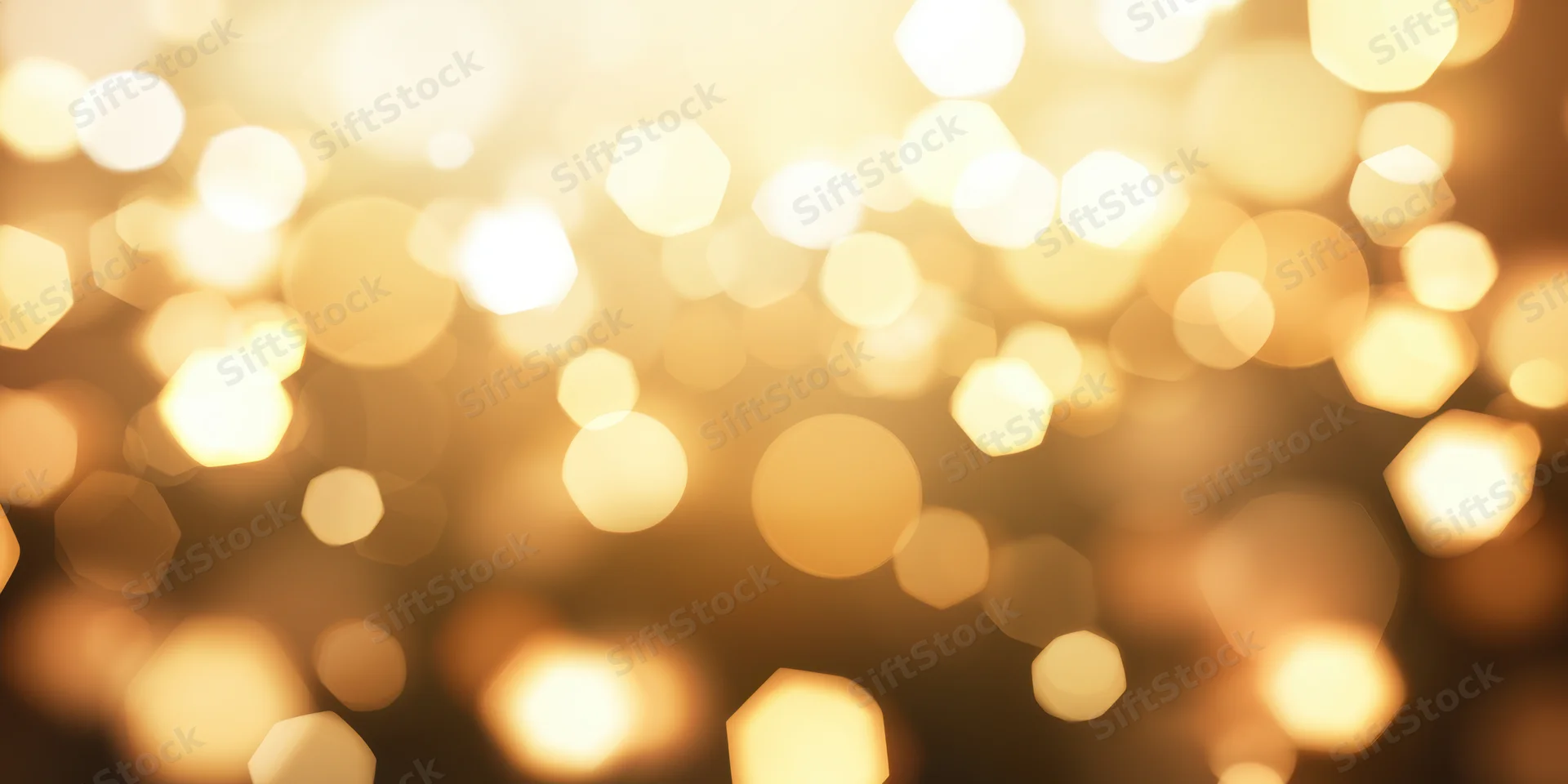Warm golden bokeh lights in soft focus creamy gradient background