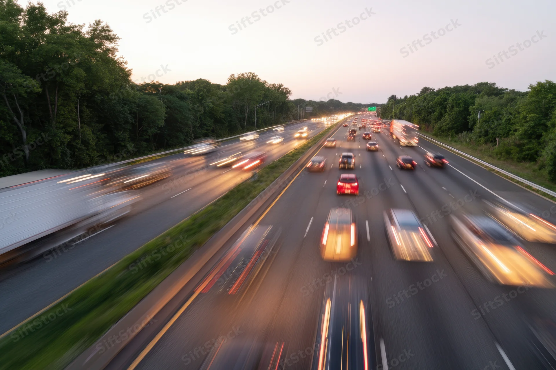 Highway traffic with motion blur from moving vehicles during evening rush hour