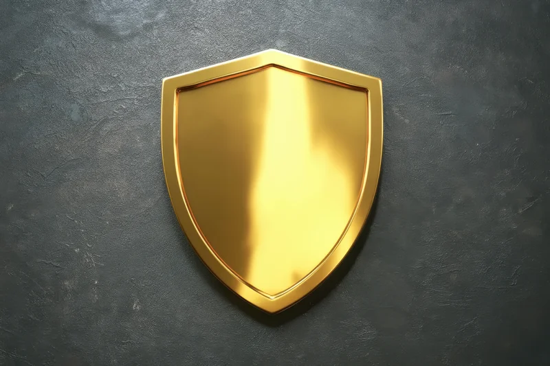 Golden shield emblem displayed against dark textured background