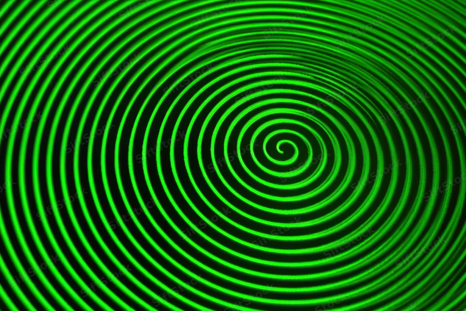 Green concentric circles forming a spiral on a radar display screen