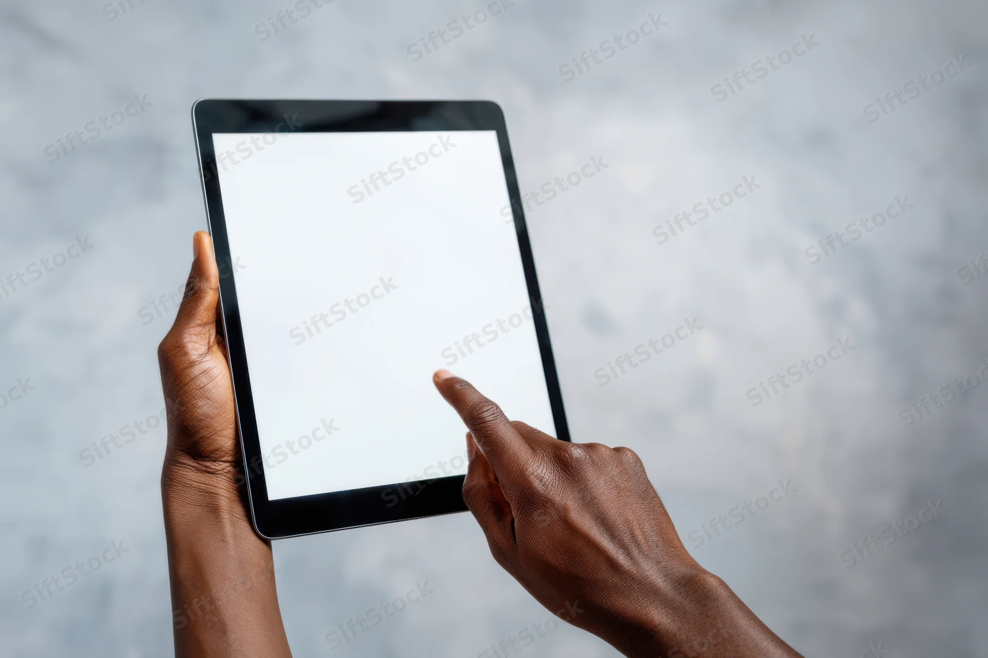 Hands holding a tablet with a blank white screen and one finger tapping it