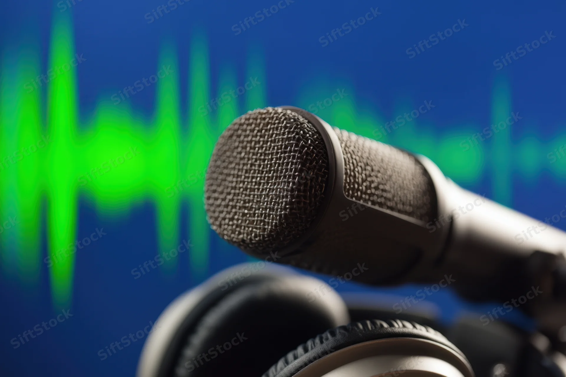 Microphone positioned above headphones with green soundwave on blue background