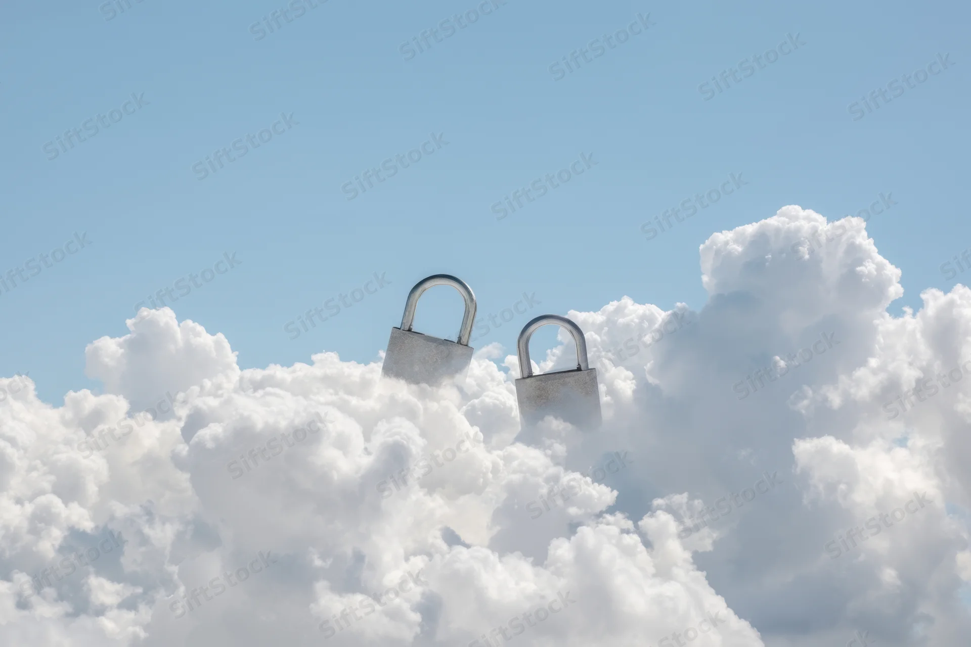Two large padlocks hovering among fluffy white clouds in a clear blue sky