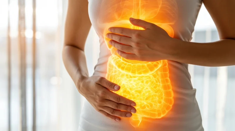 Woman holding her abdomen with glowing neon illustration of digestive organs visible through her torso