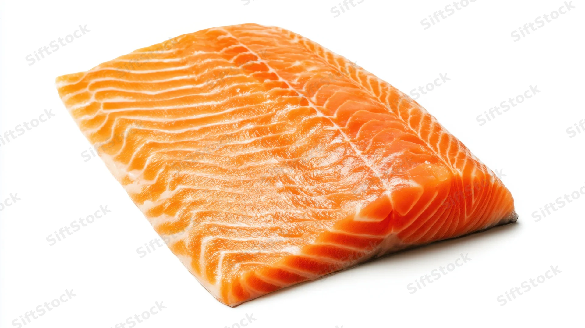 Close-up of a raw salmon fillet with visible marbling on white background