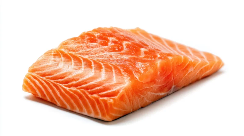 Fresh salmon fillet with vibrant orange color on white background