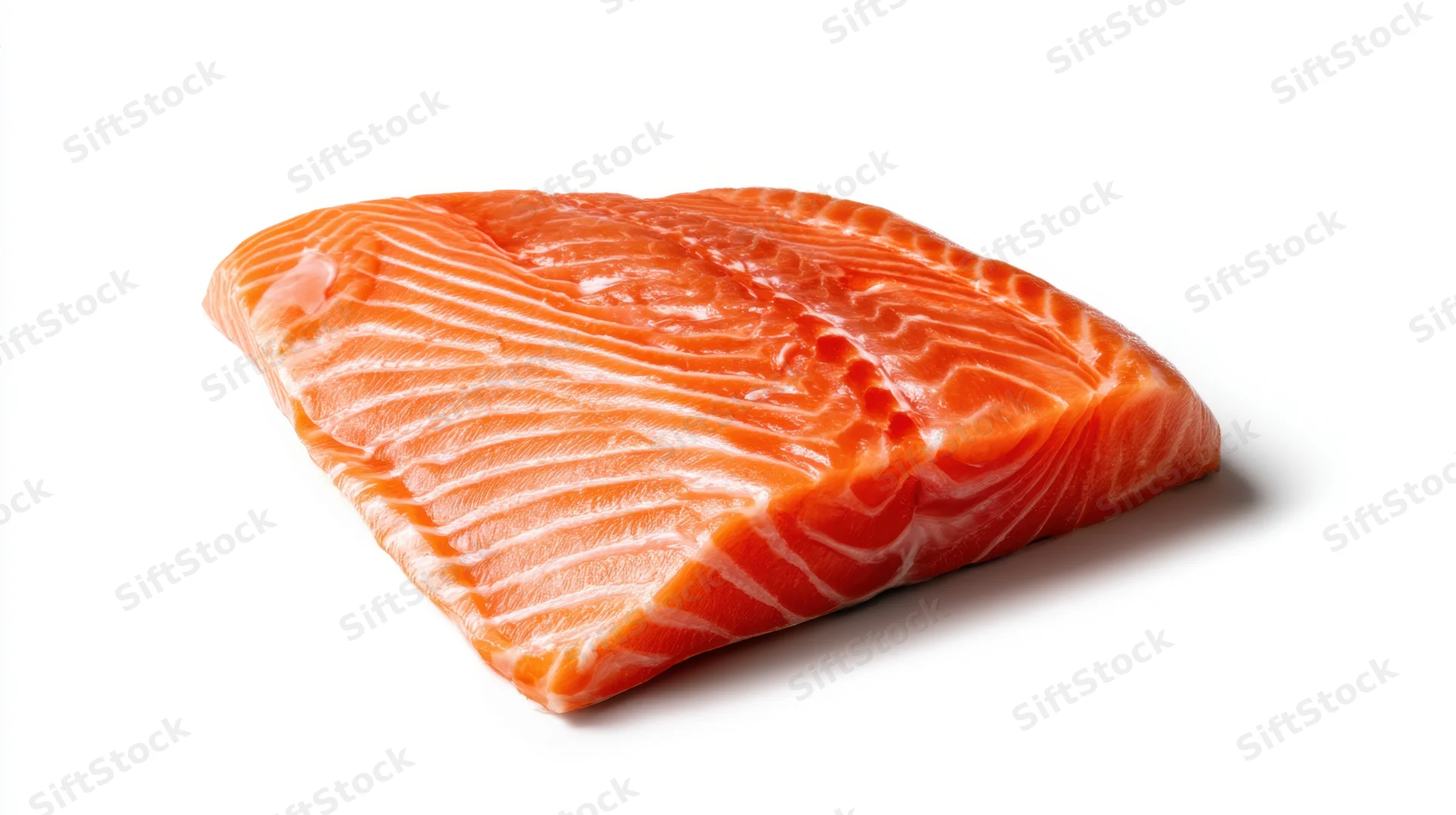 Fresh salmon fillet with vibrant orange color on white background
