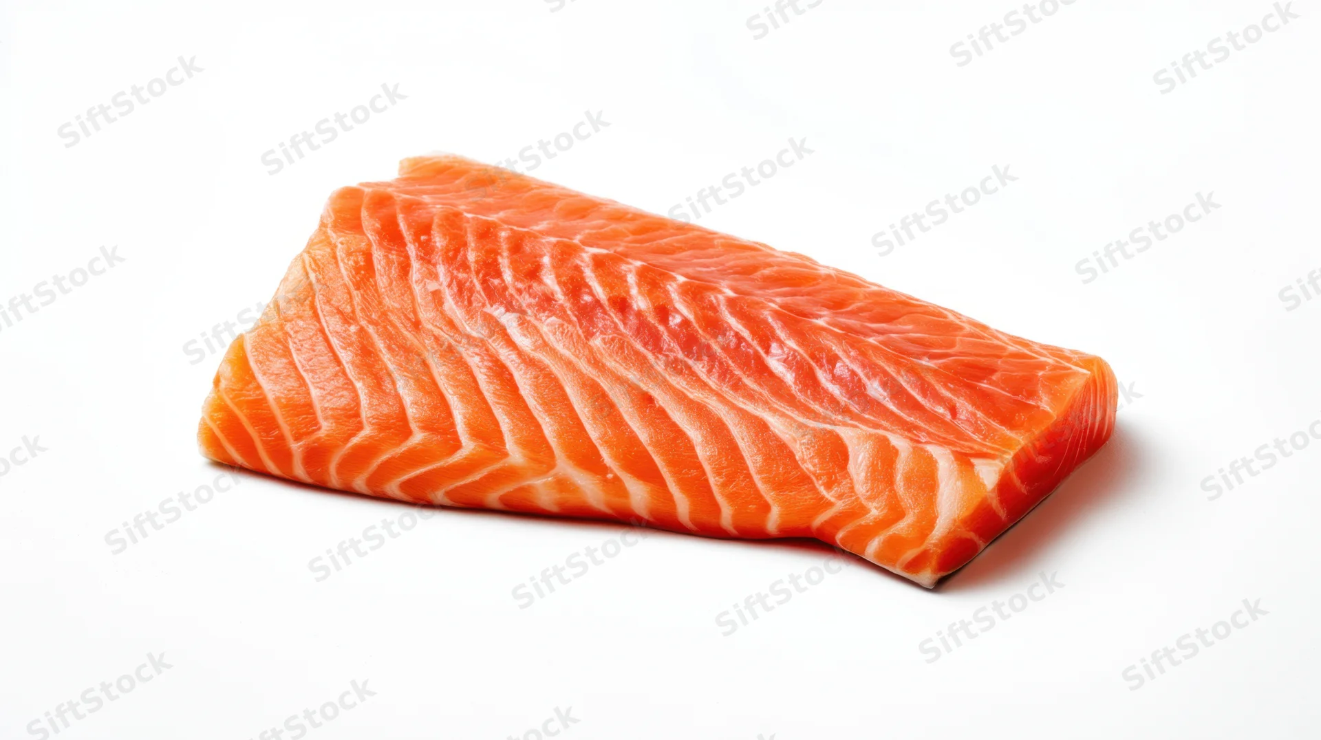 Fresh salmon fillet with vibrant orange color on white background