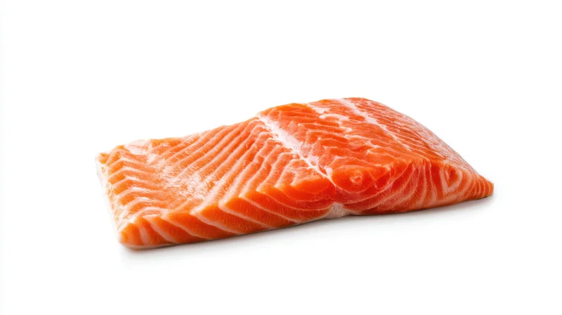 Fresh salmon fillet with vibrant orange color on white background