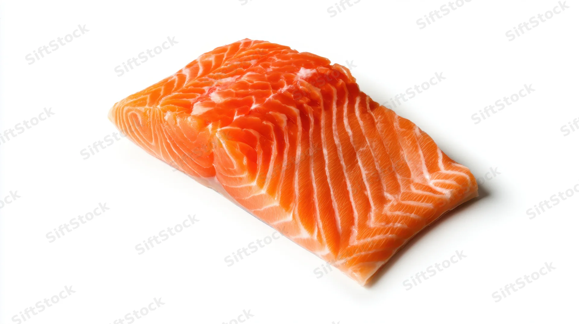Fresh salmon fillet with vibrant orange color on white background
